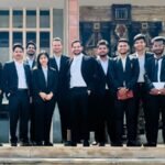 Group of young Indian advocates outside a courthouse, representing junior lawyers set to benefit from the Supreme Court's proposed stipend fund