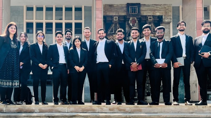 Group of young Indian advocates outside a courthouse, representing junior lawyers set to benefit from the Supreme Court's proposed stipend fund