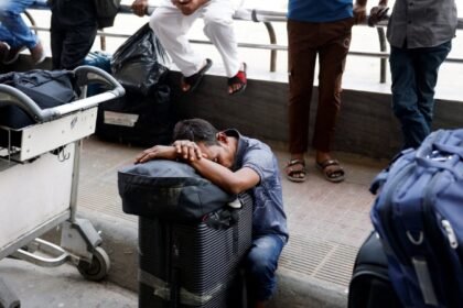 Travelers with luggage at an airport, representing Indian students whose exams were disrupted by conflict in West Asia