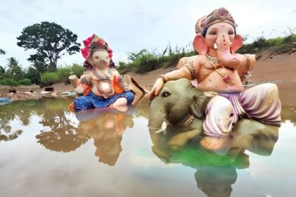 Ganesha idols on a riverbank, affected by the Bombay High Court's ban on PoP idol immersion in natural water bodies
