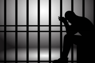 Silhouette of a person behind jail bars, symbolizing the wrongful 88-day detention in the Lonavala identity mix-up case