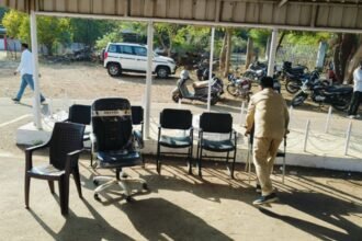 Office chairs and furniture removed from the Pune PWD office and placed outdoors during a court-ordered attachment