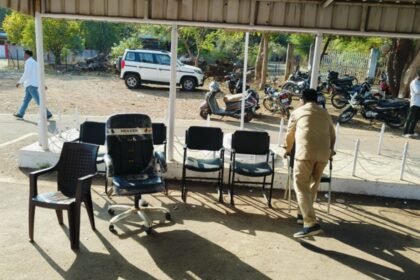 Office chairs and furniture removed from the Pune PWD office and placed outdoors during a court-ordered attachment