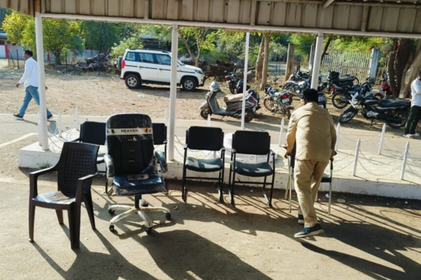Office chairs and furniture removed from the Pune PWD office and placed outdoors during a court-ordered attachment