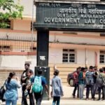 Students gathered outside the Government Law College building gate