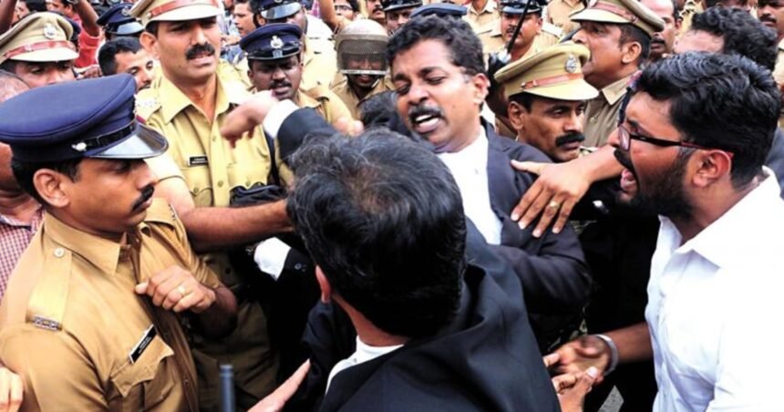 Police officers and a lawyer in a black robe in a tense, crowded confrontation