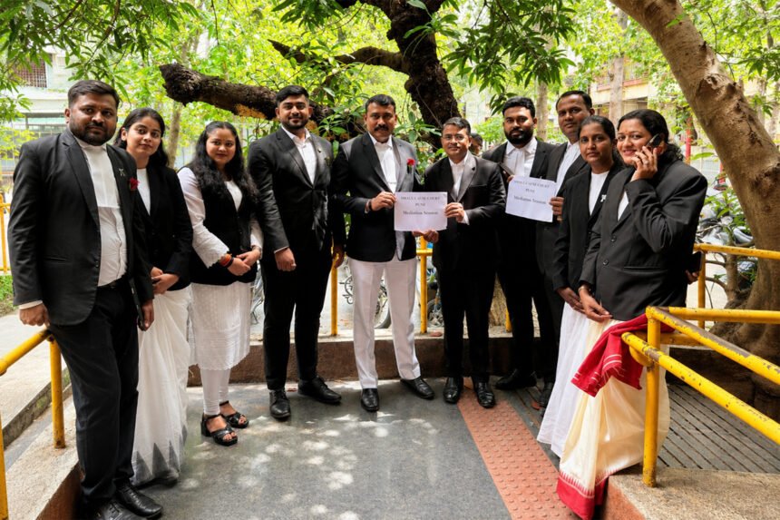 Group of lawyers in black coats standing together outdoors in a show of solidarity